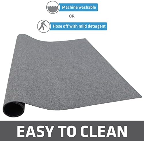 Drymate washable puppy pad hanging up to air dry after cleaning.