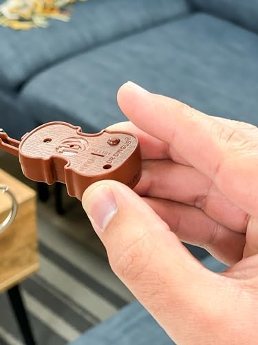 DR DINGUS miniature violin keychain being used in an office setting as a sarcastic complaints response tool