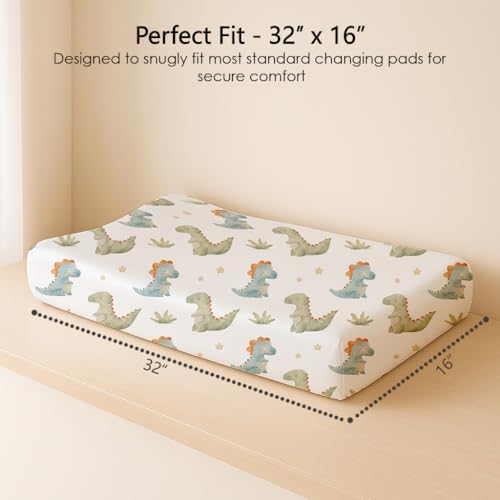 Infant boy lying comfortably on the soft My Little Zone dinosaur themed changing table sheet during a nursery update.