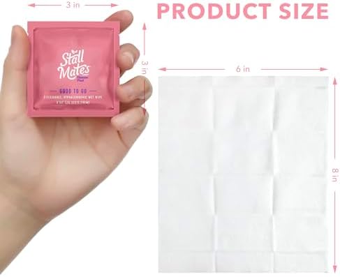 Individually wrapped Stall Mates travel wipes spread out on a white surface.