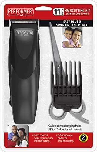 Wahl corded electric hair clipper unboxed with five colorful guide combs spread out.