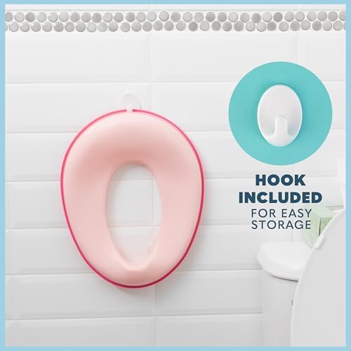 Pink portable kids potty seat hanging on the included storage hook