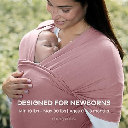 Caregiver demonstrating the hands-free convenience of the adjustable mauve baby wrap.