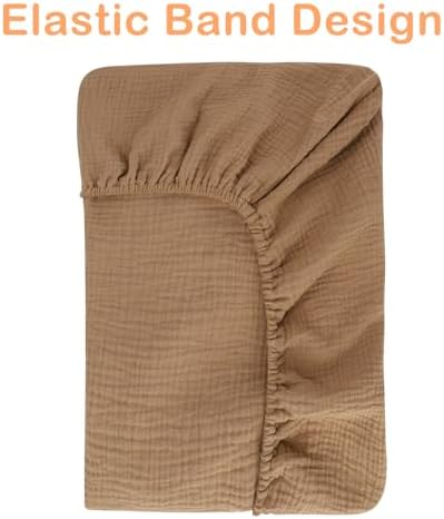 Two pack muslin baby changing pad covers folded neatly