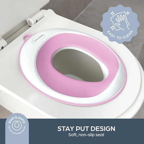 Dreambaby portable travel potty seat showing the elongated fourteen point five inch contoured shape