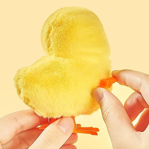 Side profile of clockwork spring mechanism on the Arcimatto jumping chicken toy for kids