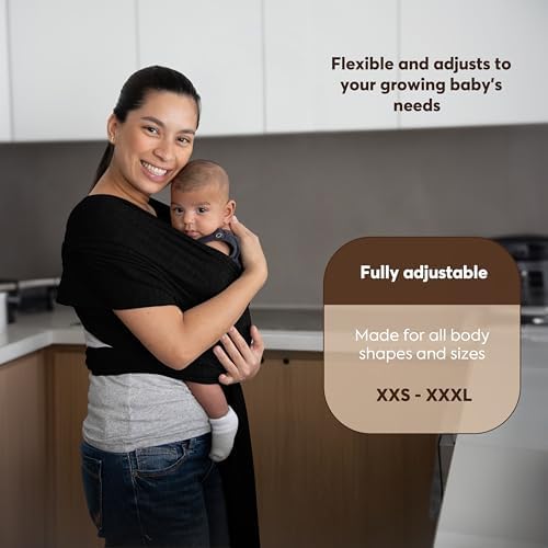 Hands free baby carrier wrap being tied securely around a parent's torso for back support