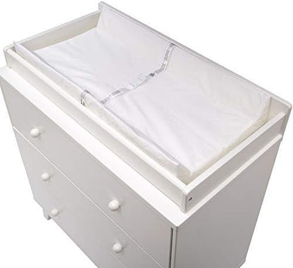 Beautyrest changing pad secured to nursery dresser with straps