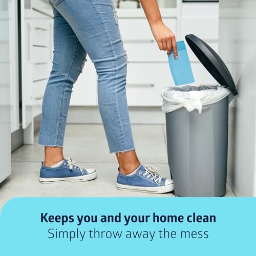 Caregiver neatly folding a soiled medline disposable underpad for quick sanitary disposal.