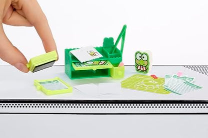 Detailed close-up of working miniature stamps and desk organizers from Series 3