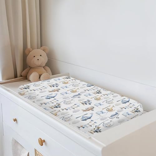Top down view of baby aircraft themed changing table mattress cover