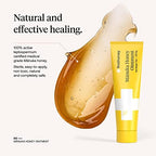 Antibiotic free burn care and scar gel ointment tube alongside its original protective box.