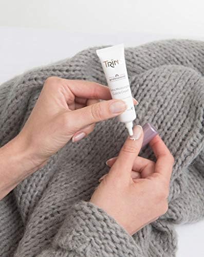 Application of Trind Extra Moisturizing Cuticle Cream on fingernails