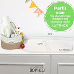 Bophili 30 by 16 inch changing table pad in use inside a basket