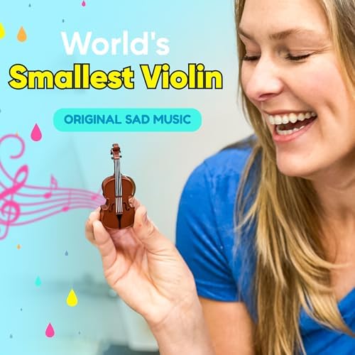 DR DINGUS tiny violin novelty gag gift held in hand to showcase pocket-sized proportions