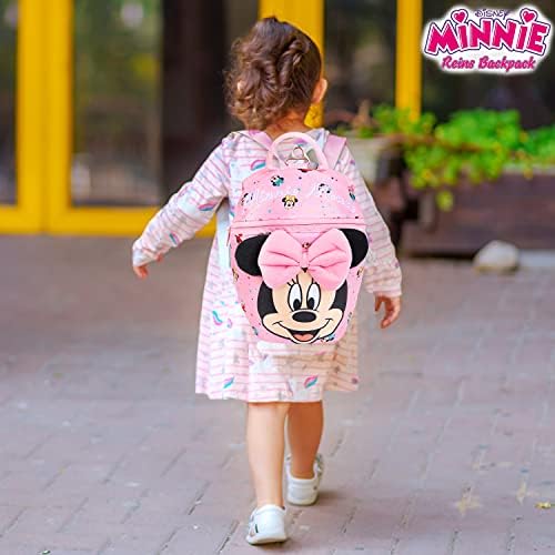 Toddler wearing Disney Minnie Mouse safety harness backpack