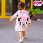 Toddler wearing Disney Minnie Mouse safety harness backpack