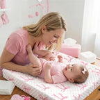 SmoothNovelty pink bow changing pad cover lifestyle view