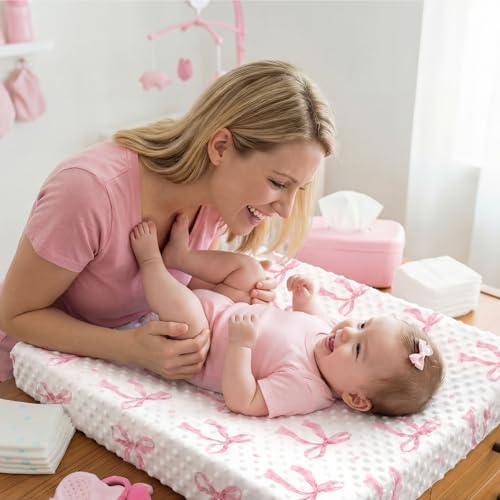SmoothNovelty pink bow changing pad cover lifestyle view