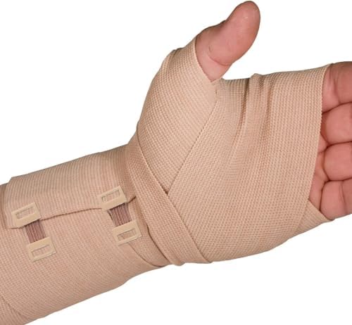 Hand holding metal bandage clips to demonstrate adjustable stretch.