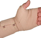 Hand holding metal bandage clips to demonstrate adjustable stretch.