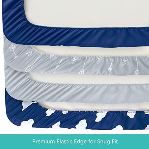 Fitted baby cradle sheets stretched over a standard changing pad showing the secure elastic skirt.