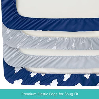 Fitted baby cradle sheets stretched over a standard changing pad showing the secure elastic skirt.