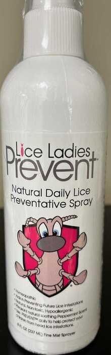 Professional lice removal mousse and repellent spray bottles side by side.