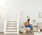 Regalo 36 inch tall child safety gate extended wide across a home doorway
