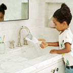 Gray and white Munchkin faucet extender pieces for bathroom
