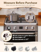 Black stove knob covers installed on a modern gas stove