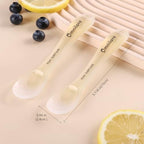Omnilove toddler utensils with safety chain attached to a high chair for mess free feeding.
