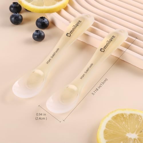 Omnilove toddler utensils with safety chain attached to a high chair for mess free feeding.