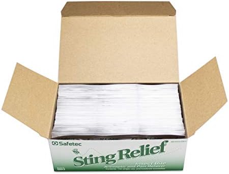 Close up of antiseptic sting relief wipe being removed from foil packet.
