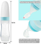Infant fruit squeeze feeder bottle standing upright with protective cap attached