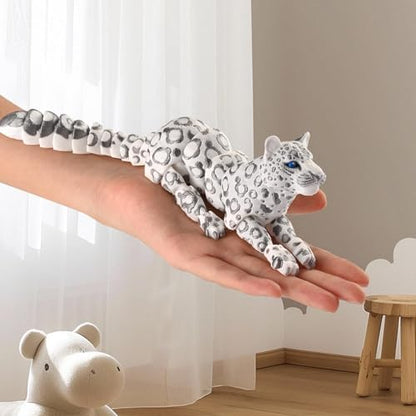 Poseable 3D printed snow leopard in dynamic position