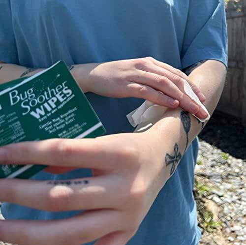 A person pulling a pre-moistened plant-based bug repellent sheet out of the travel pouch.