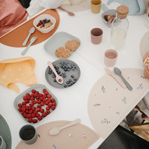 Top view of Mushie sage green toddler feeding utensils