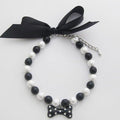 PetFavorites diamond dog necklace front view showing black pearls and rhinestone bone charm.
