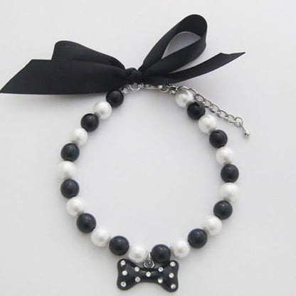 PetFavorites diamond dog necklace front view showing black pearls and rhinestone bone charm.