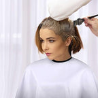 Pack of three multi colored comb out capes for salon hair styling and cutting.