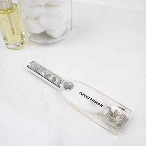 Tweezerman callus shaver blade exposed for removing thick dead skin.
