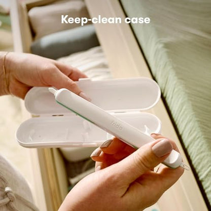 Frida Baby nail cleaner tool showing the specialized tip for under-nail dirt