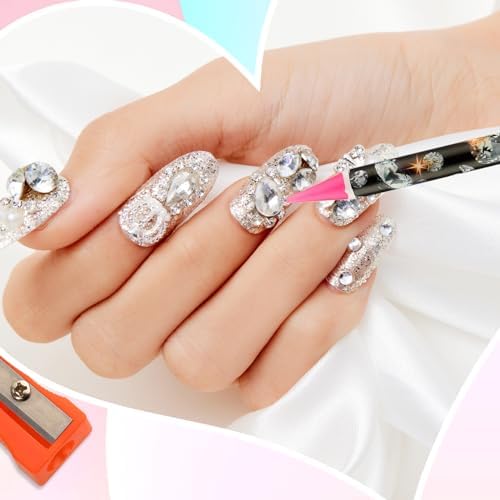Detailed application view of the nail point drill pen placing a rhinestone onto a manicured fingernail.