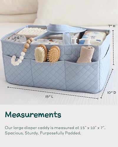 Close up of quilted fabric and handles on baby caddy