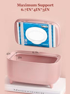 Travel friendly baby wipe heater plugged in on nursery table