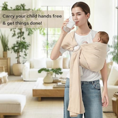 Infant sitting ergonomically in a cream cotton baby carrier sling