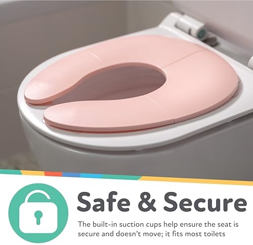 Underneath view of pink Nuby travel potty seat highlighting built-in suction cups