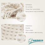 Queness beige diaper changing table sheet texture closeup