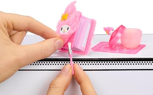 Unboxed components of the Cinnamoroll mini notebook and Kuromi eraser craft kit